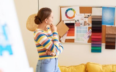 Interior designer selecting calming bedroom colors from paint and fabric swatches on a design board — Landry Designs